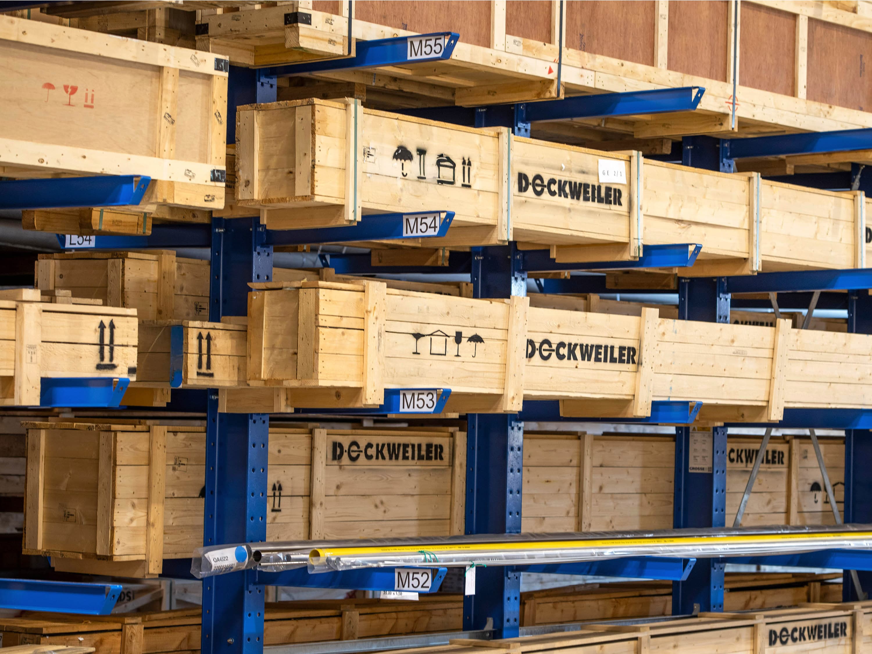 High-bay warehouse with wooden crates printed with Dockweiler